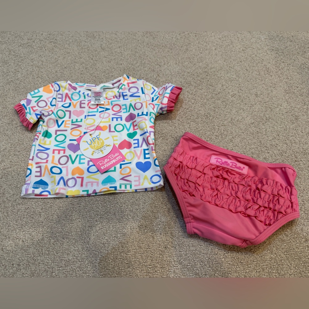 RuffleButts LOVE Print White Top and Pink Bottom Swimsuit